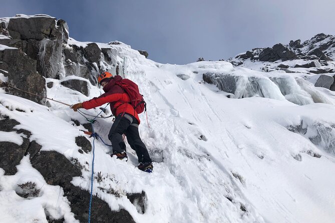 Private Guided Winter Mountaineering Experience in the Cairngorms - Harness, helmet, rope, and frozen cliffs
